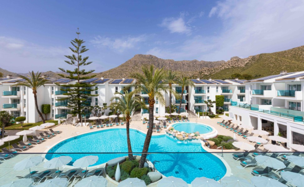 views from the main pool and the serra de tramuntana mountains from the junior suite at MarSenses Pollensa Hotel & Spa views from the main pool and the serra de tramuntana mountains from the junior suite at MarSenses Pollensa Hotel & Spa